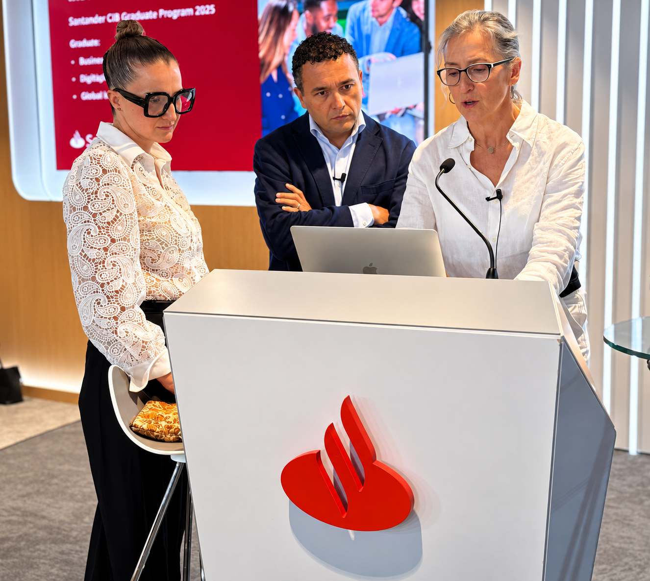 SALUZ faculty at the podium during a Santander CIB Graduate Programme session
