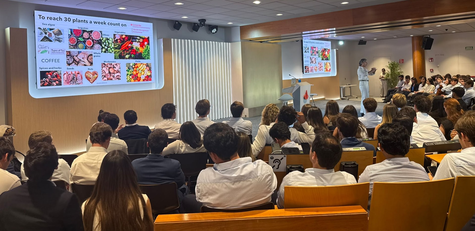A SALUZ faculty member presenting plant-based nutrition research to a Santander CIB Graduate Programme cohort